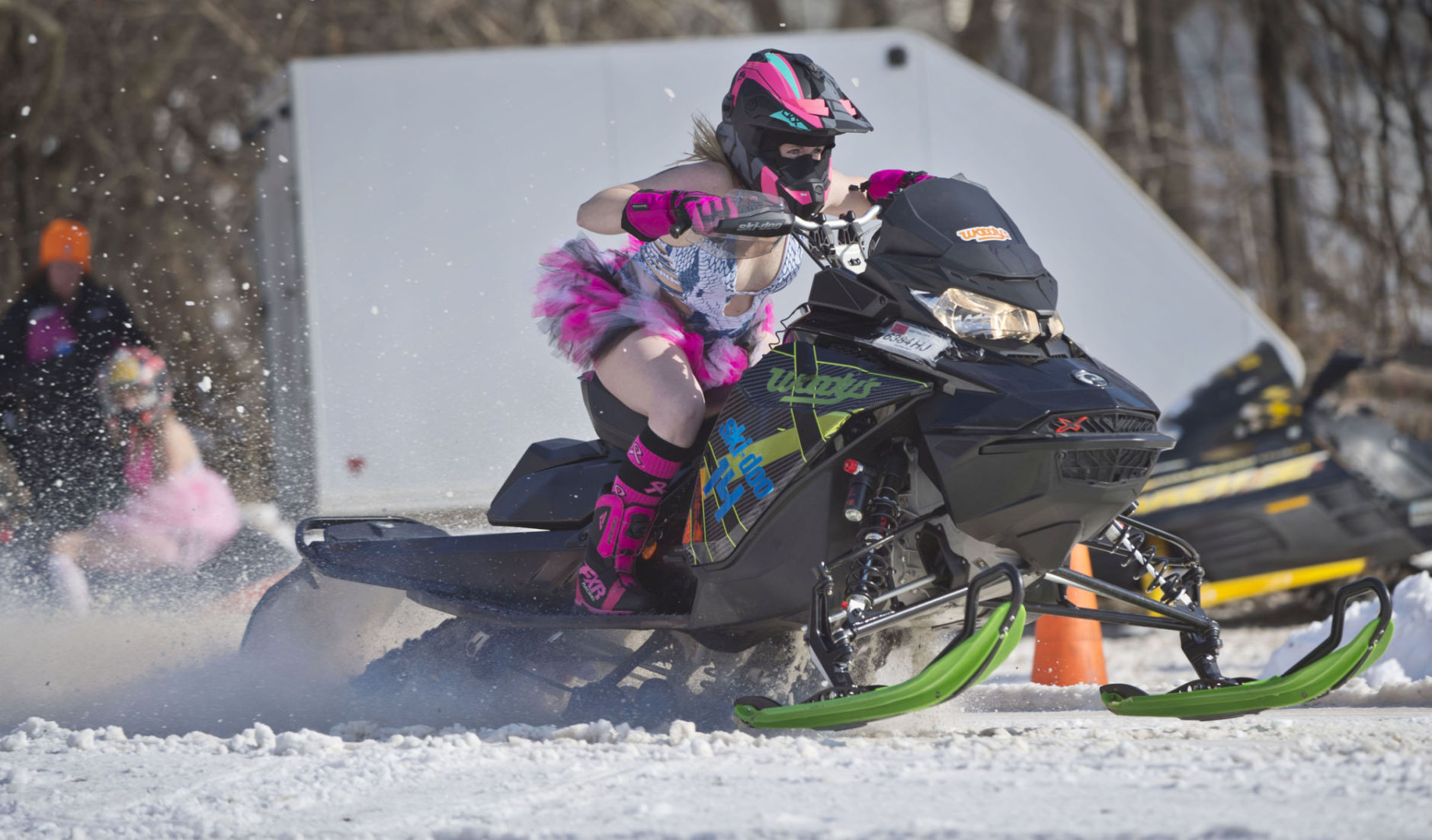 Bikini-clad snowmobilers rally again to fight breast cancer